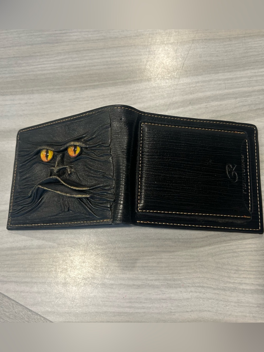 Men's Black Leather Bi-Fold Wallet with Embossed Face and Yellow Eye Accent - Picture 6 of 14